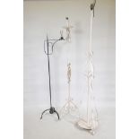 Three wrought metal floor lamps, largest 64" high