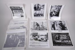 A quantity of black and white film photographs and press kits, 10" x 8"