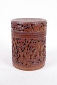 An antique Chinese bamboo container and cover, well carved with figures in various pursuits, 6½" x