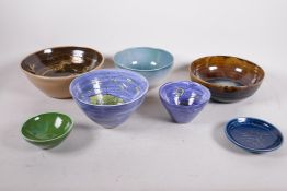 A collection of seven studio pottery bowls, largest 9" diameter, most signed SMH