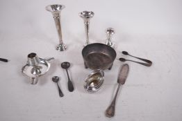 A quantity of scrap silver, 241 grams, and three weighted hallmarked candlesticks