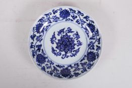 A Chinese blue and white porcelain cabinet dish with scrolling lotus flower decoration, 8½" diameter