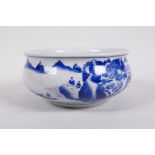 A Chinese blue and white porcelain bowl decorated with figures in a riverside landscape, 6" diameter