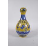 A Chinese yellow ground porcelain garlic head shaped vase decorated with cranes in flight, 6