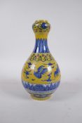 A Chinese yellow ground porcelain garlic head shaped vase decorated with cranes in flight, 6