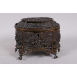 A C19th gilt metal casket, decorated with a tavern scene, and genre scenes, A/F gilt worn away and