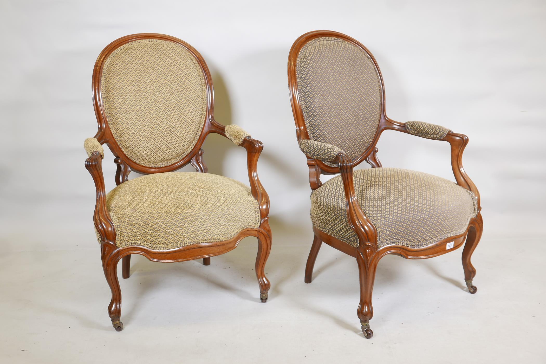 A pair of walnut spoonback open armchairs with carved and shaped arms, raised on cabriole supports - Image 2 of 4