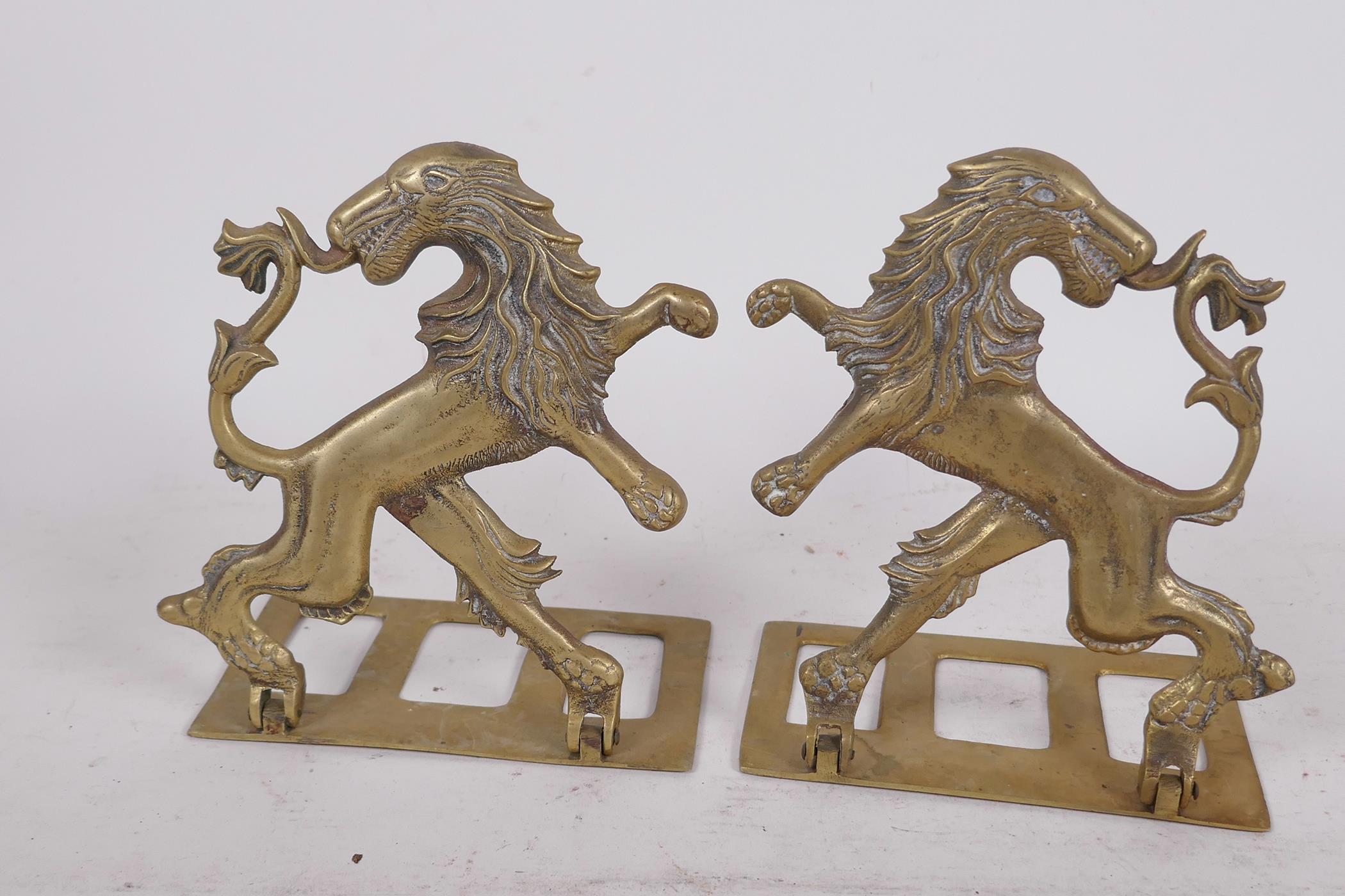 A pair of heraldic brass folding bookends made in the form of a lion rampant reguardant, 5½" high - Image 2 of 2