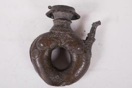 An antique Chinese bronze ewer cast as two fish spouting water, with dragon spout, 7" high (hinged