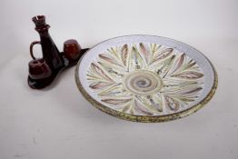 A Bourne Denby Glyn Colledge charger, 13" diameter, together with a Denby four piece cruet set