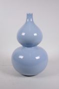 A Chinese duck egg blue glazed porcelain double gourd vase, seal mark to base, 12½" high