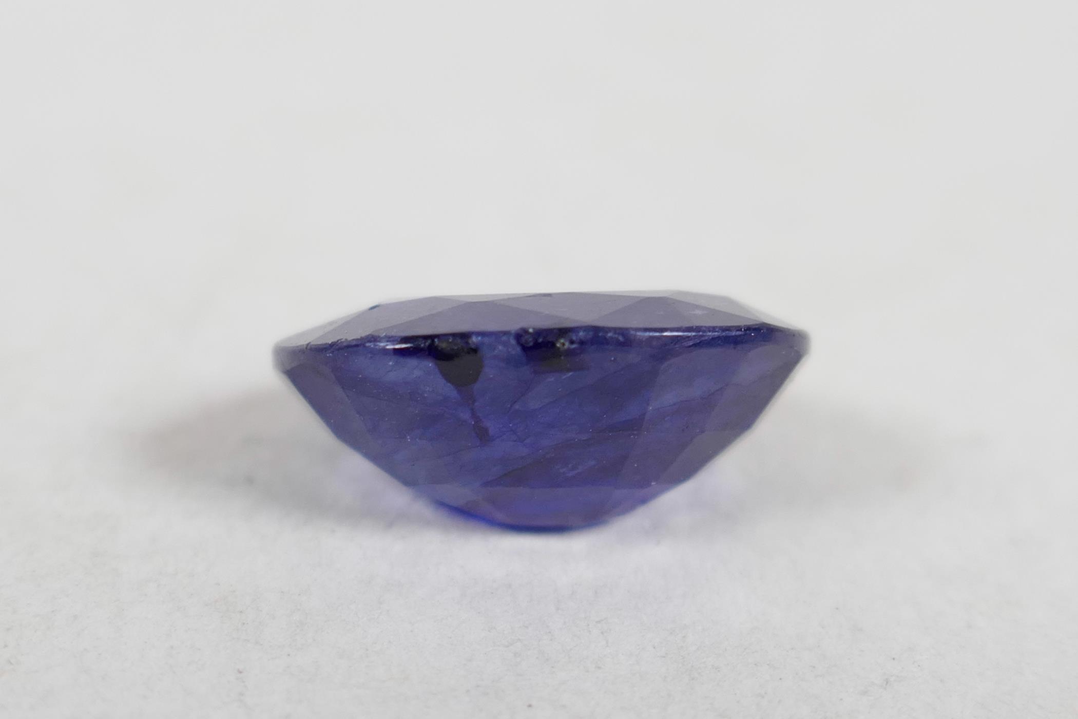 An 8.10ct blue sapphire, oval mixed cut, IDT certified, with ceritificate - Image 2 of 5