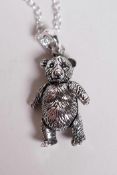A 925 silver pendant necklace in the form of a teddy bear with articulated limbs, 1" drop