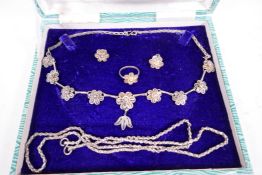 A suite of Indian silver filigree flowers jewellery comprising necklace, finger ring and earrings,