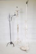 Three wrought metal floor lamps, largest 64" high