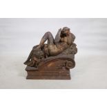 An early C19th hollow cast iron architectural feature in the form of a classical nude, remnants of