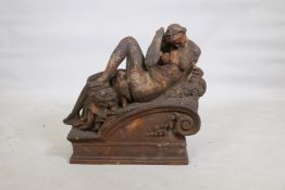 An early C19th hollow cast iron architectural feature in the form of a classical nude, remnants of