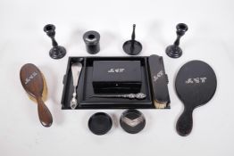 An early C20th ebony dressing table set personalised with silver initials, tray 13" x 7½"