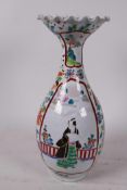 A C19th Chinese famille rose vase with wide flared rim decorated with figures and flowers in