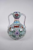 A Chinese polychrome porcelain garlic head shaped flask with two handles, and decorated with bats,