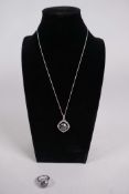 A 4ct black moissanite gemstone pendant surrounded by rose cut diamonds and set in sterling