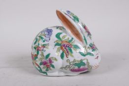 A Chinese polychrome porcelain rabbit decorated with branches bearing fruit, gourds and flowers, 4