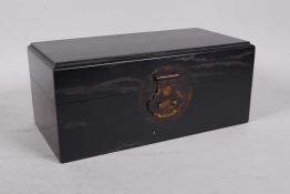 A Chinese hardwood box with a brass lock, 10" x 5", 4½" high