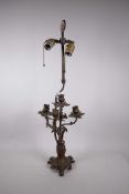 A brass rococo style four branch table lamp, 28" high