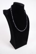 A 125ct 5.5mm black moissanite gemstone necklace, silver clasp length 18"