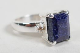 An emerald cut blue sapphire ring in sterling silver, stamped 925