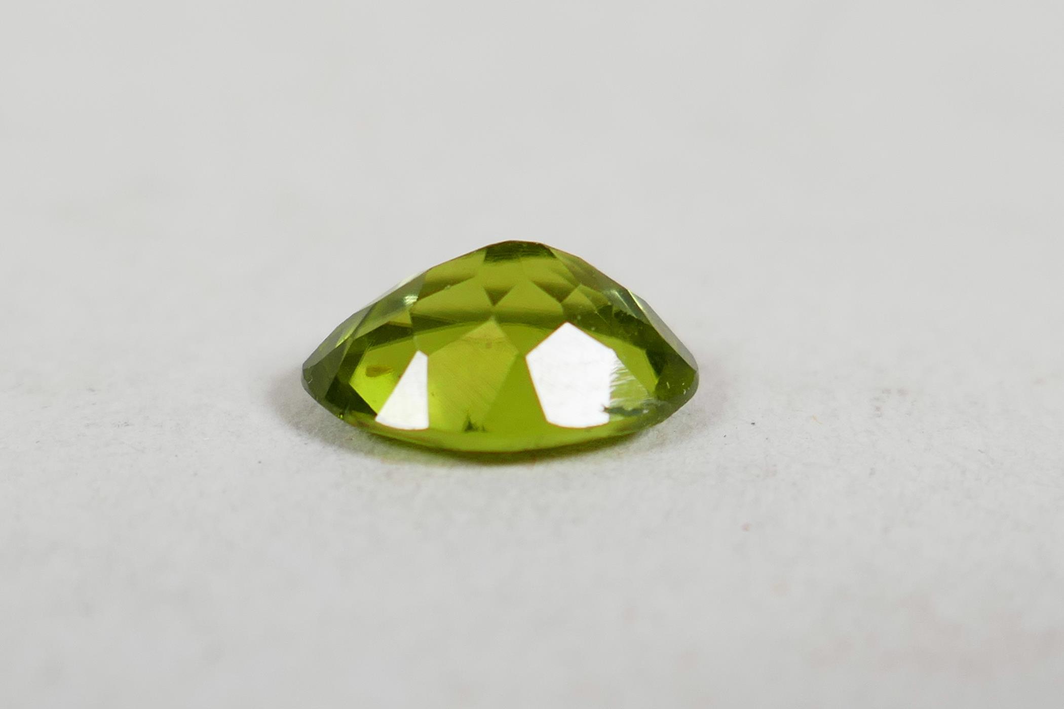 A 1.99ct peridot, oval mixed cut, ITLGR certified, with certificate - Image 5 of 8