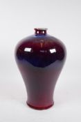 A Chinese flambe glazed porcelain meiping vase, 13" high