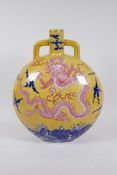 A Chinese yellow ground porcelain two handled moon flask decorated with a red dragon and blue