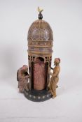 A cold painted bronze after Bergman of an Arab tower, with a concealed female nude and two male