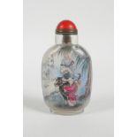 A Chinese reverse decorated glass snuff bottle depicting a sage riding a buffalo and a lakeside