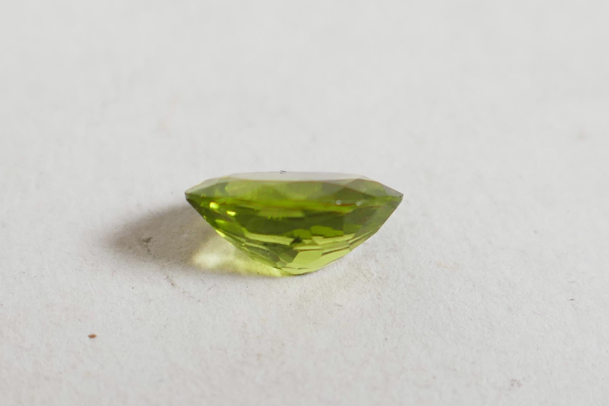 A 1.99ct peridot, oval mixed cut, ITLGR certified, with certificate - Image 3 of 8