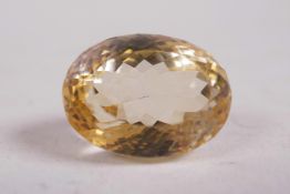 A 31ct citrine gemstone, oval cut, with IDT gem testing report
