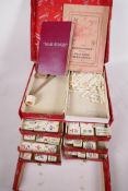 A vintage bone and bamboo mahjong set in original box, 9" x 7½" x 6"