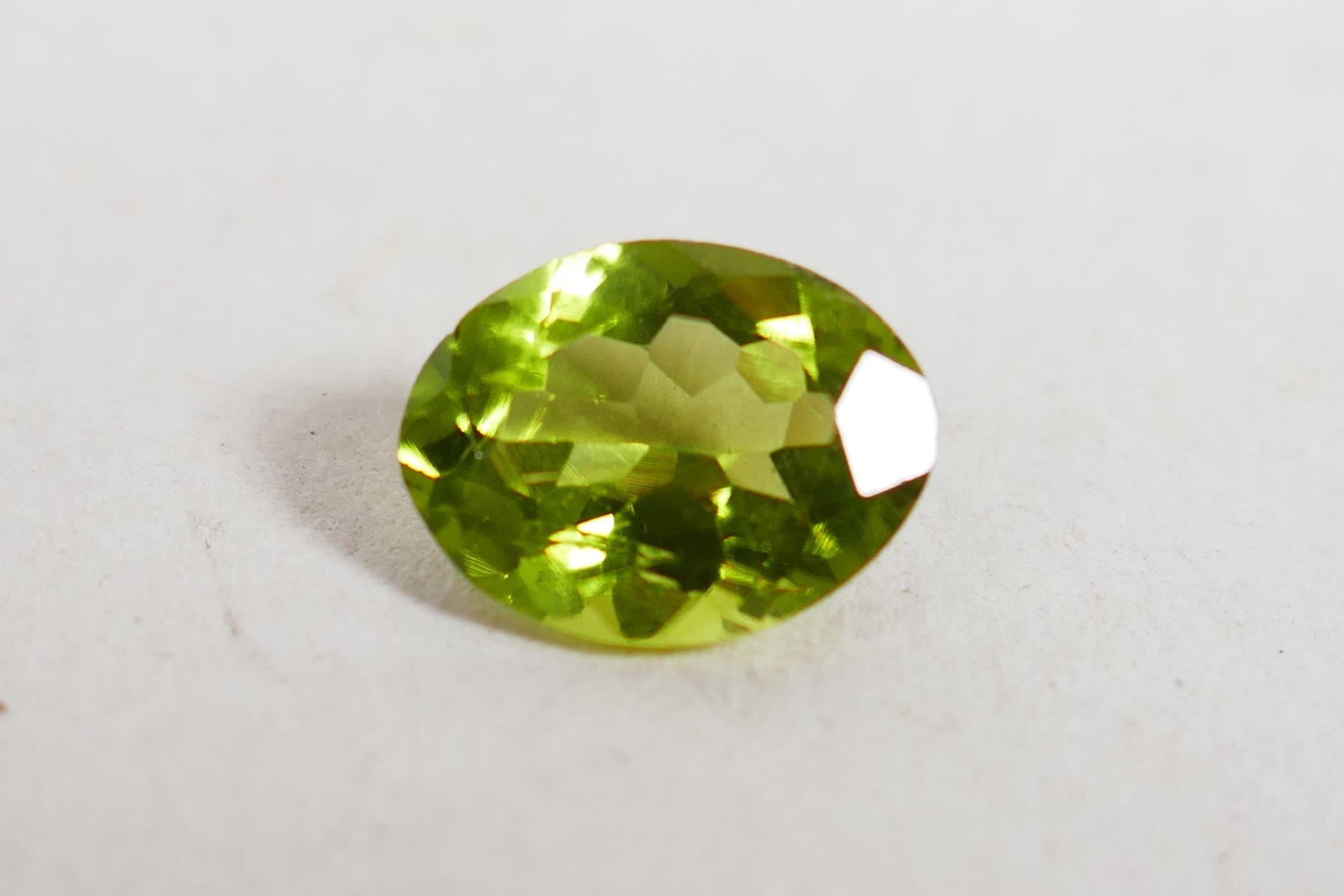 A 1.99ct peridot, oval mixed cut, ITLGR certified, with certificate