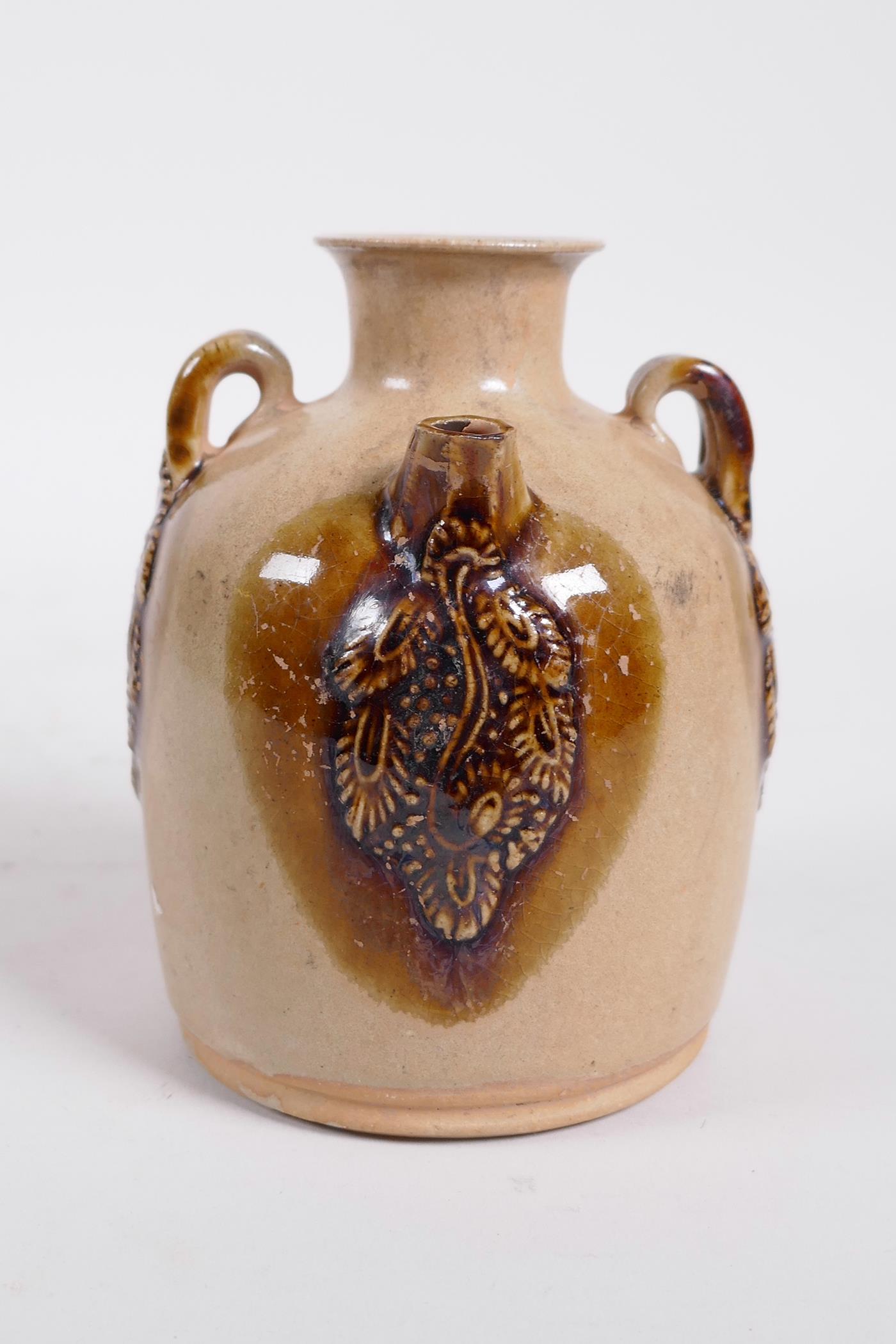 A Chinese ochre ground Changsha kiln pottery wine pourer with raised and glazed vine decoration - Image 4 of 5