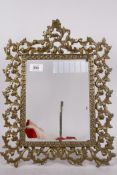 A brass easel frame with pierced borders, 17" x 13"