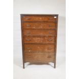 A 1930s oak tallboy with six graduated drawers, 30" x 17", 47" high