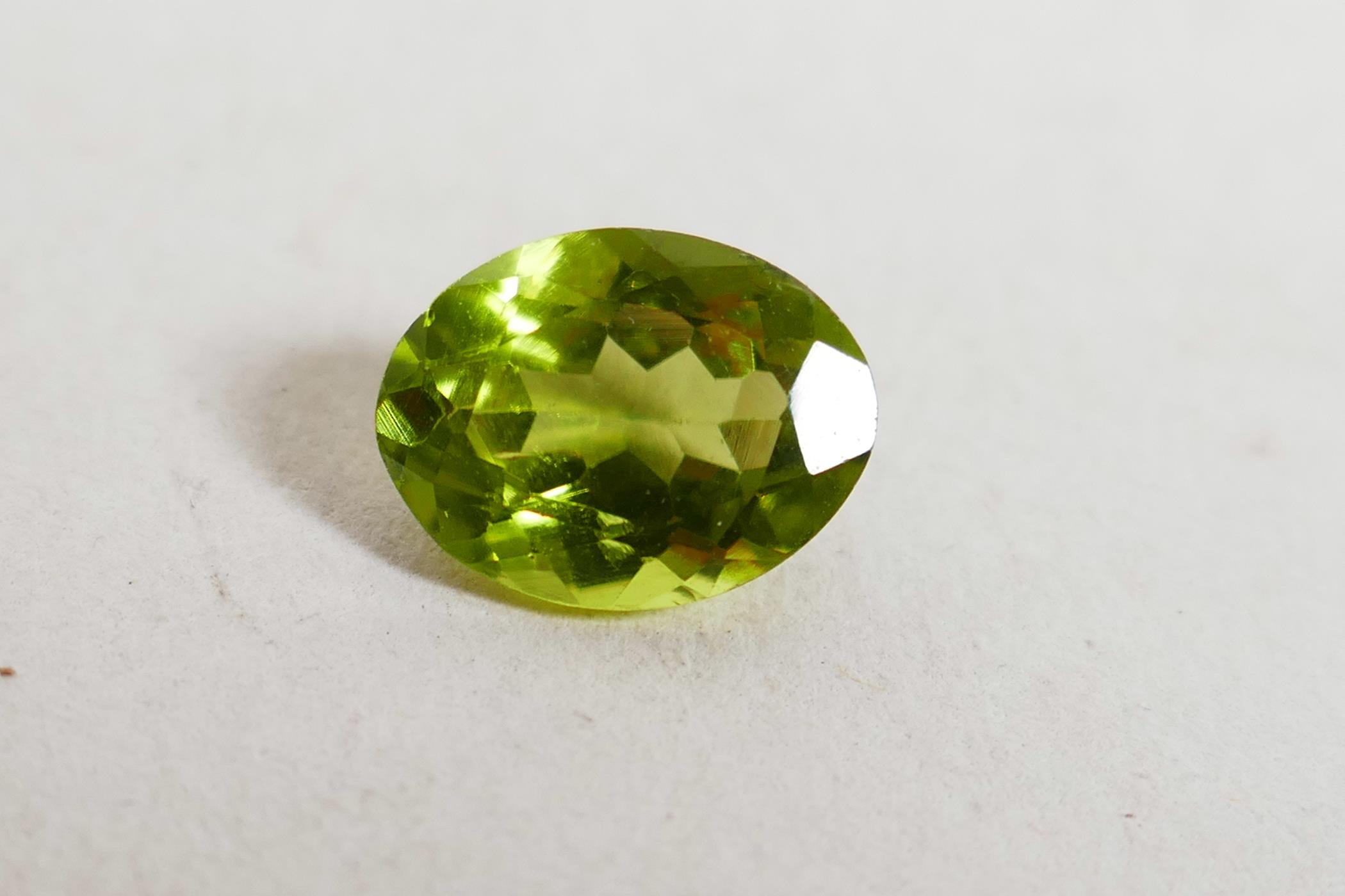 A 1.99ct peridot, oval mixed cut, ITLGR certified, with certificate - Image 2 of 8