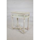 A painted vitrine, with mirror glass base, raised on turned supports united by shaped stretchers,