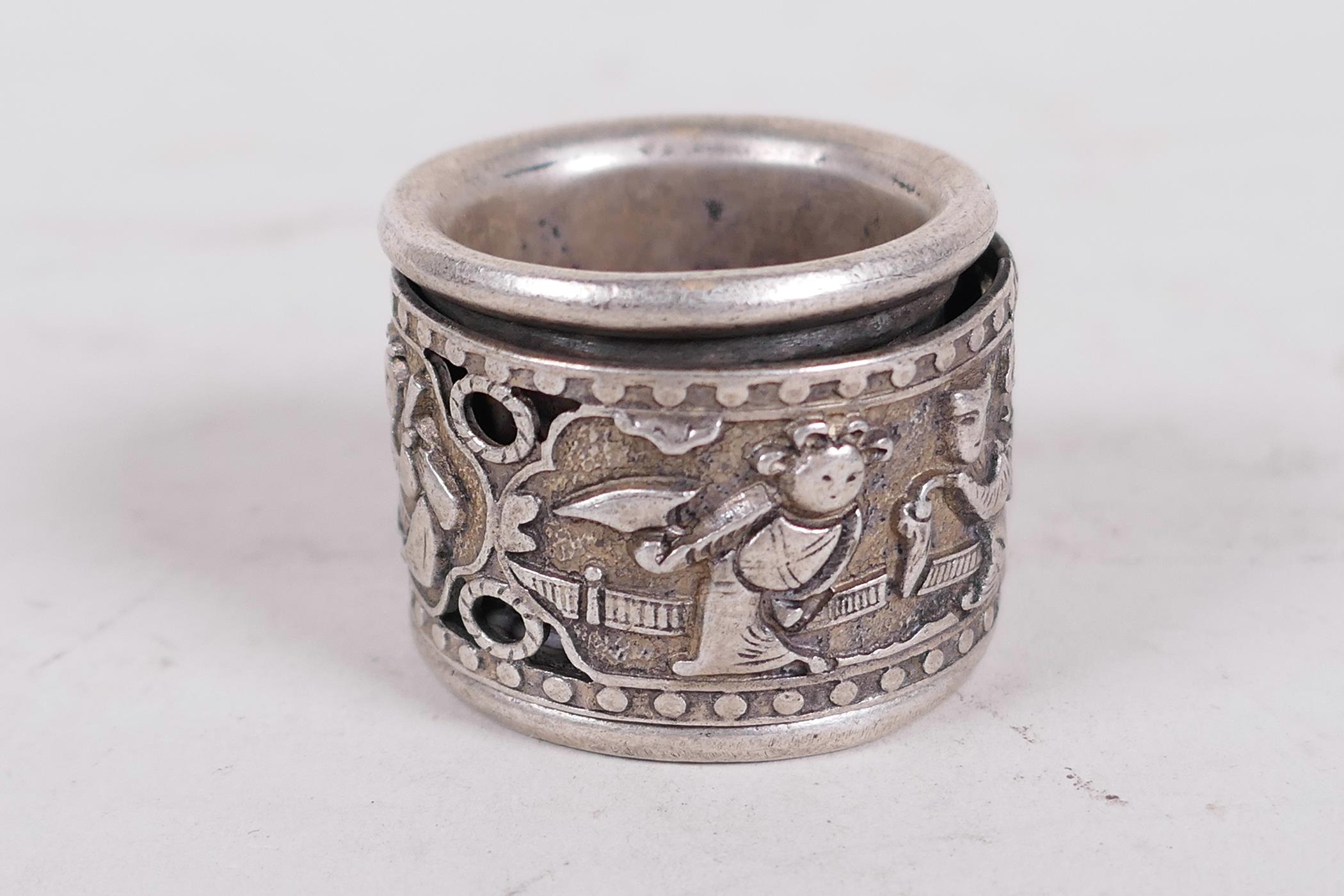 A Chinese white metal archer's ring with revolving centre section decorated with figures - Image 2 of 2