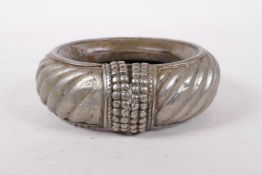 An antique Arabian/Omani silvered metal slave anklet/manilla, 5½" diameter