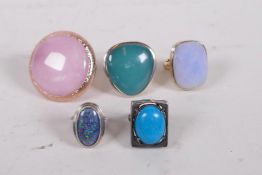 A collection of five lady's dress rings set with large semi-precious stones, including two silver