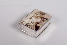A 925 silver pill box decorated with a pictorial enamel plaque depicting a late C19th woman, 1"