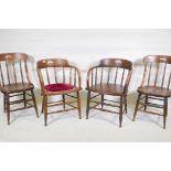 A near pair of C19th elm spindle back smoker's armchairs, and a similar pair of dining chairs,
