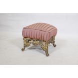 A C19th gilt brass footstool, with pierced frieze and scrolled supports, 14" x 14" x 14"